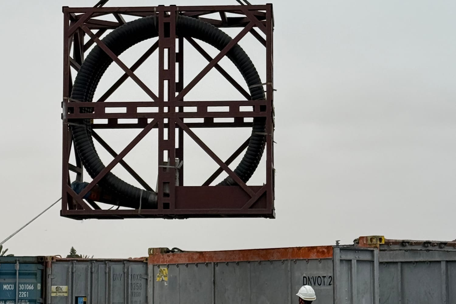 DNV 2.7-1 certified offshore lifting frame mid-lift, containing a coiled flexible riser hose – the heavier offshore certification regime Afrishore supplies and tests rigging equipment to.